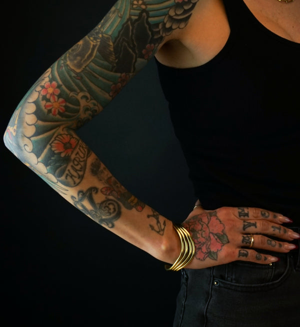 Quadruple Swerve Brass Bangle